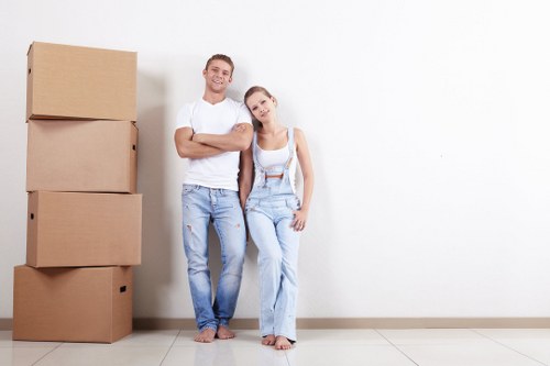 Removal van and moving team in a New Cross residential street