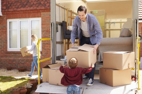 Packing and loading office furniture during a New Cross move