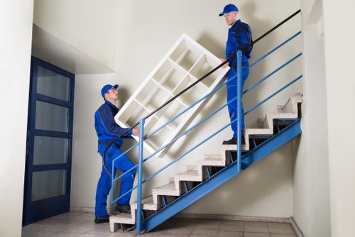 Professional removal team loading household items for transport