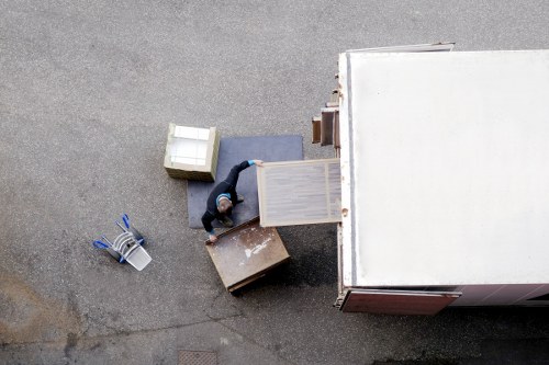 Removal team loading furniture for a home move in New Cross