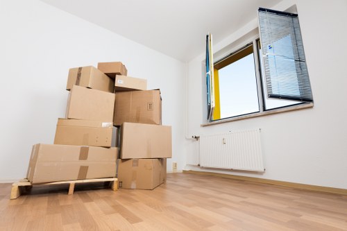 Local removals van loading items from a flat near New Cross