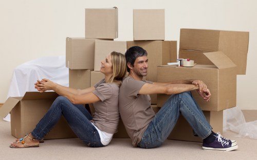 Local movers loading items safely for a New Cross relocation