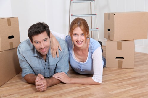 Professional movers handling house removal items