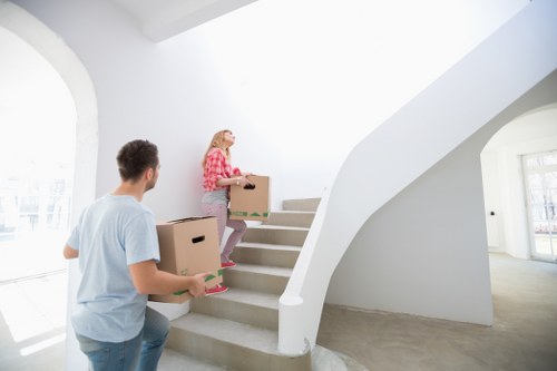 Prepared moving boxes and furniture for a New Cross house relocation