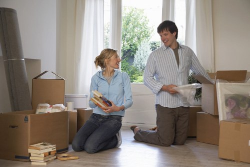 Packing and loading household items into a moving van in New Cross