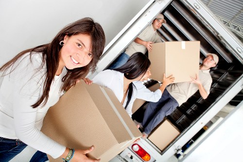 Movers handling a flat removal with stairs in New Cross